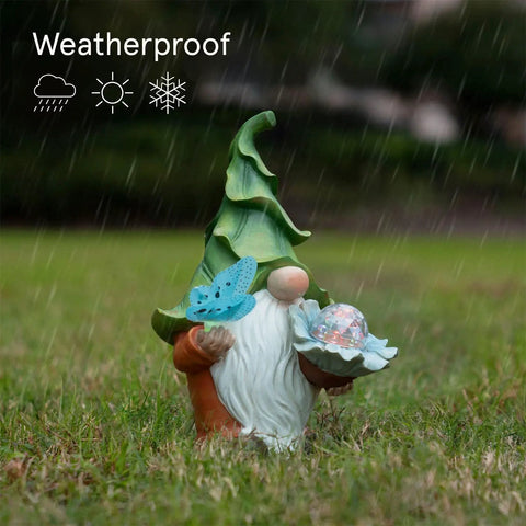Front view of Solar Gnome Garden Statue With Light Up Orb And Butterfly Resin Outdoor Yard Decor for Patio Lawn Porch in rain
