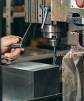 304 stainless steel sheets with double-side protective film; 6x6x0.04 in, 8 pcs being machined on a milling machine