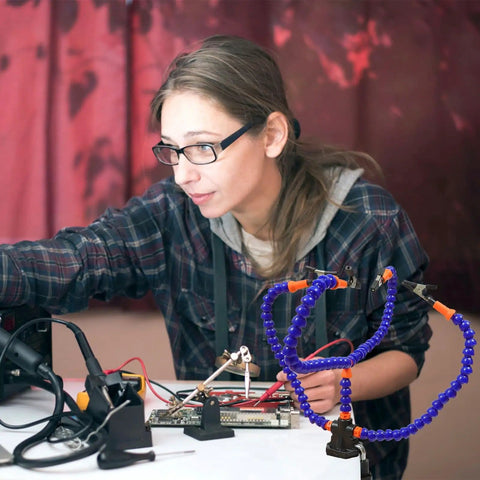 User assembling electronics with Adjustable Soldering Helping Hands Station With Four Flexible Arms Blue Clamp Mount Welding Aid Platform