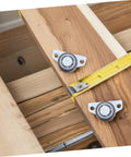 Heavy Duty 4 Pack Adjustable Sliding Door Roller Wheels Built Tough For Heavy Wooden Doors And Barn Hardware No Fuss Whisper Quiet Bearings Easy Closet Swap on wooden surface with measuring tape.