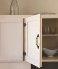 Open cabinet with beige ceramic handle of Eight Piece Ceramic Drawer Handles Set In Chinese Style With Vintage Antique Design