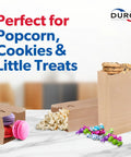 Kraft Paper Lunch Bags 500 Count Bulk with SOS bottom, filled with popcorn, cookies, macarons, and candy for snacks display.