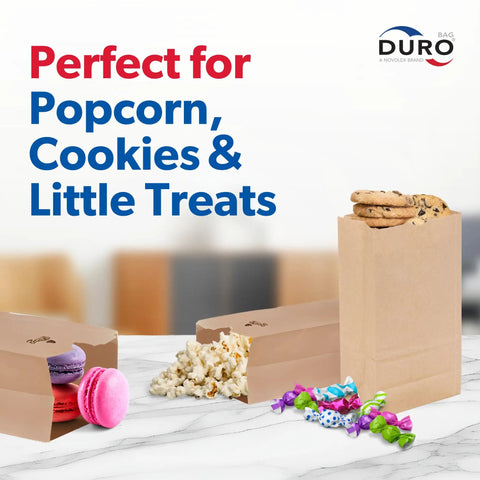 Kraft Paper Lunch Bags 500 Count Bulk with SOS bottom, filled with popcorn, cookies, macarons, and candy for snacks display.
