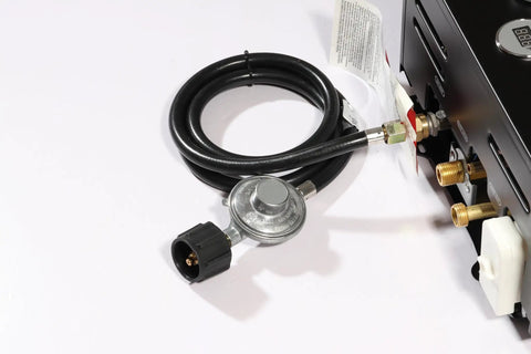5Ft Propane Regulator And Hose For Grills, Fire Pits, Water Heaters, And Outdoor Cooktops Universal Replacement, connected to a gas appliance