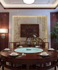 Dining room setup with an Explosion Proof Round Tabletop Rotating Serving Tray 360 Degree Turntable With Heavy Duty Glass Surface.