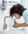 Child washing hands under Brushed Nickel 8 Inch Widespread Bathroom Faucet With Two Handles 360 Degree Swivel Pop Up Drain