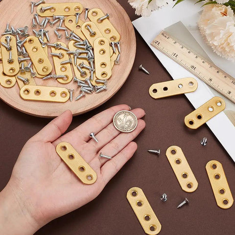 Golden Flat Straight Mending Brackets Kit With 80 Screws 20 Pieces Metal Fixing Plates shown with ruler and hand for size reference