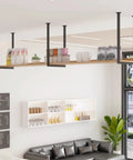 Solid As A Rock Heavy Duty Floating Shelf Bracket With Ceiling Mount And Screws For Kitchen Or Bar Wrought Iron Industrial Pipe Style holds a wooden shelf with decorative items.