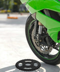 Rear Sprocket Gear With Bore And Pitch For Dirt Bike And Electric Scooter Replacement shown near green motorcycle