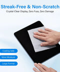 Hand using Streak Free Crystal Clear Electronic Wipes For Screens Pre Moistened Screen Cleaner Wipes on a tablet screen
