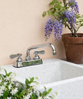 Lead-Free 4 Inch Deck Mount Commercial Kitchen Sink Faucet 8" Swivel Spout with chrome finish above a white sink.