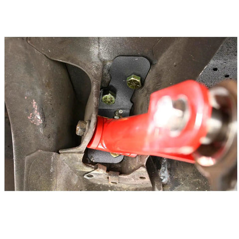 Fox Mustang Torque Box Reinforcement Plate Kit 79-04 TBR002 TBR003 Bolt-In Beefed-Up Upgrade for 1979-2004 Mustangs, black steel plate installed on rear suspension mount