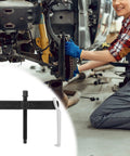 Heavy Duty 12 Inch 2 Jaw Gear Puller With Adjustable Clamping Depth on workshop floor with mechanic in background