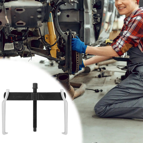 Heavy Duty 12 Inch 2 Jaw Gear Puller With Adjustable Clamping Depth on workshop floor with mechanic in background