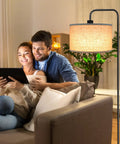 Couple on sofa with Tall Floor Lamp With Hanging Shades For Living Room And Bedroom beside them