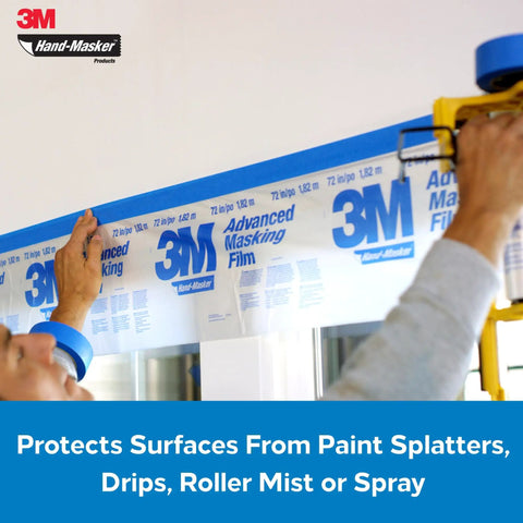 Person applying Pro Grade Masking Film For Hand Masker 48 Inch By 180 Foot Roll with static cling feature on wall