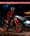 Rider on HAPPYRUN F18 Electric Dirt Bike Mid-Drive Motor 6000W Peak showing headlight and taillight in night setting