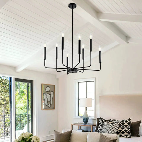 8-Light Modern Black Farmhouse Chandelier With Industrial Metal Arms And Candle-Style Cups in a living room setting