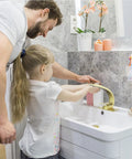 Father and daughter washing hands using Brushed Gold Bathroom Faucet With Single Handle Basin Mixer For 1 Hole Or 3 Hole Mount
