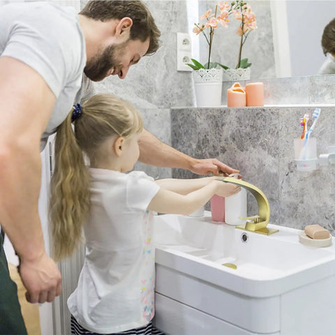 Father and daughter washing hands using Brushed Gold Bathroom Faucet With Single Handle Basin Mixer For 1 Hole Or 3 Hole Mount