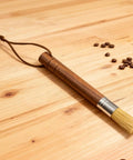 Grinder Cleaning Brush Set With Walnut Wood Handle And Natural Bristles For Espresso Machines And Home Baristas on wooden surface