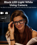 Woman reading and wearing Meta glasses with LED Light Blocking Stickers for Gen 1 and 2, showing LED light coverage at night.