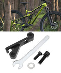 IS Mount To Flat Mount Brake Adapter For 160mm Rear Or 180mm Front Rotors with tools and mountain bike in background