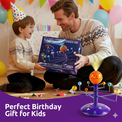 Talking Astronomy Solar System Model Kit For Kids With Immersive Projector, Exhibits 8 Planets Orbiting The Sun On Any Surface, STEM Toy For 5 Plus Year-Olds, Hands-On Space Science Learning, Turns Ceilings Into A Planetarium. Father and son holding boxed solar system toy at a birthday party.