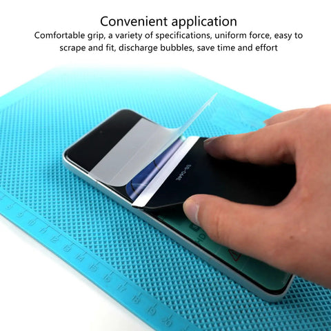 Person using Badass Silicone Screen Protector Scraper For Phone Tablet Laptop Film Application on smartphone for bubble removal.