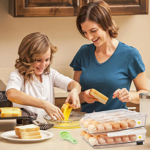 Mother and daughter using Egg Organizer For Refrigerator, 36 Egg Stackable Storage Box on kitchen counter with bread and eggs