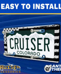 Blinged Out Queen License Plate Frame Chrome And Clear With Nine Glass Crystals Black Glitter Lettering On Bottom Zinc Die Cast With Show Chrome Finish And Durable Fastener Caps on blue vehicle with anti-theft feature, easy to install text.