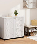 White waterproof outdoor storage cabinet with two doors and decorative design, placed indoors, showing resin material and compact size.