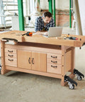 Built Tough Retractable Workbench Caster Kit Moves Heavy Shop Load With Zero Sweat Smart Step Brakes on a wooden workbench.