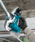 Compact 18V Cordless Brushless Portable Band Saw Featuring No Fuss Blade Setup Variable Speed Throttle And Rugged Aluminum Guide Rail in action cutting steel pipe.