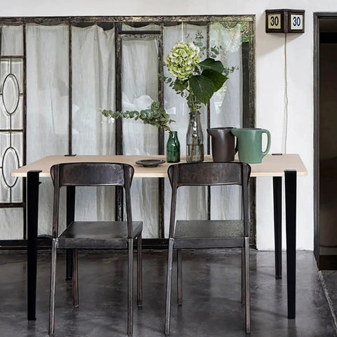 Built Tough As Nails Heavy Duty Table Legs, 28 Inch Adjustable F Shape Base, Black Finish under a light wood tabletop.
