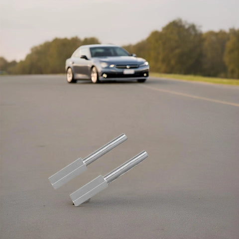 Heavy Duty 2 Pack Shock Extensions 3 Inch Swing Arm For 3/8 Drive Impact Ratchets Zinc Coated Socket Adapters 3/8 24 Thread lying on pavement with car in background.
