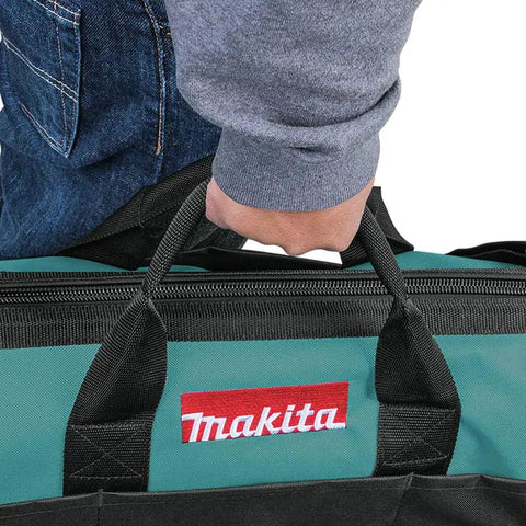 Person carrying Makita 20 Inch Contractor Tool Bag Built For The Job Site With Heavy Duty Zippers Reinforced Handles And Industrial Fabric