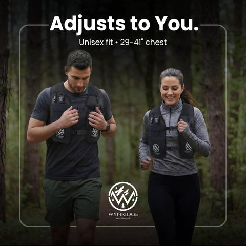 Two people jogging in forest wearing hydration running vest with 8 pockets and 17 oz flask for men and women reflective lightweight