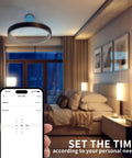Bedroom lit with Go To Smart Plug Dimmer With Remote, phone showing brightness settings, Alexa ready digital light switch.
