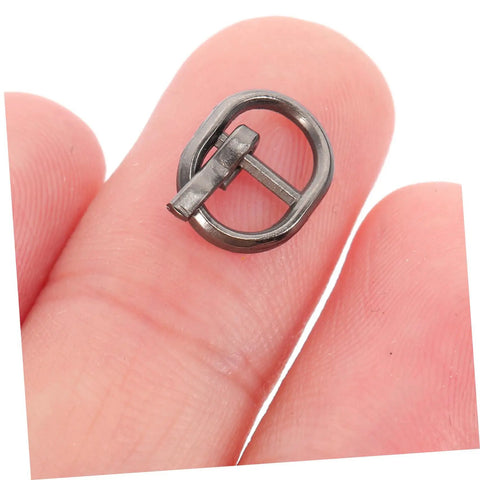 Close-up of a tiny alloy buckle in gunmetal color from 150 Pieces Mini Belt Fasteners Tiny Alloy Buckles For Doll Clothes And Shoes Diy Crafting Mixed Silver Gunmetal Antique Bronze Colors Easy Assembly Miniature Sewing Accessories