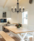 8-Light Black Chandeliers For Dining Room And Kitchen, Vintage Farmhouse Candle Chandelier hanging above wooden dining table.