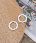 30Pcs Flat Washers 304 Stainless Steel 10x16x1mm Door Hinge Gaskets on wooden surface