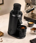 Heavy Hitter 80 MM Flat Burr Coffee Grinder With Variable Speed Motor And No Fuss Stepless Dial featuring 58 MM portafilter fork and 70 GM hopper.