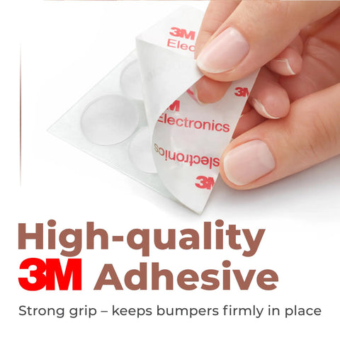 Hand holding clear 3M adhesive backing for Skip Annoying Door Slams Cabinet Bumpers And Self Adhesive Silicone Furniture Pads.