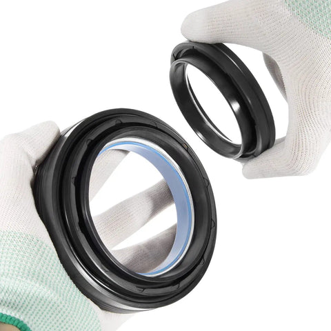 Hands hold Ford Super Duty Front Axle Seals Kit With Outer Dust Seal Inner Tube Seal Needle Bearing Snap Ring And Thrust Washer For Dana 50 60