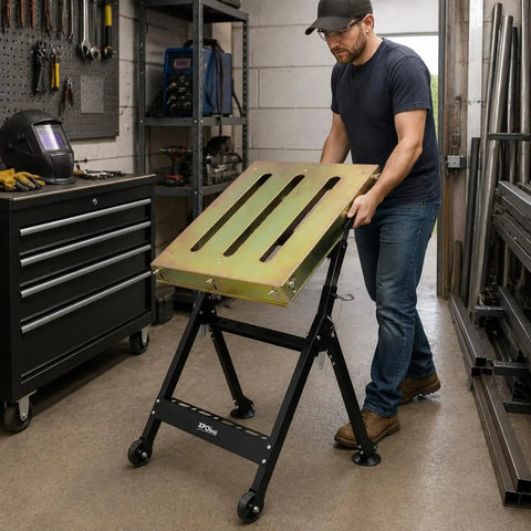 Man adjusting Heavy Duty Welding Table 36x18 Inch Portable Workbench On Wheels With Braking Lockable Casters in workshop