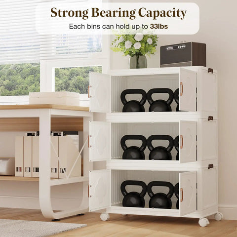 Premium Stackable Storage Bins With Smooth Rolling Wheels And Secure Snap Lids Game Changing Hella Spacious Plastic Organizers Fold Flat For Garage Closet Pantry 3 Pack Cream White storing kettlebells in rolling bins with open doors.