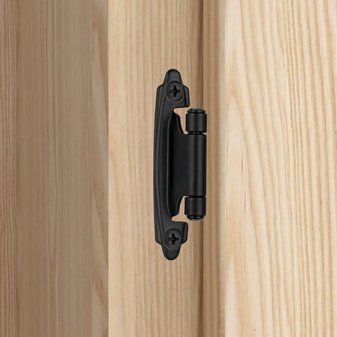 Rock Solid Matte Black Cabinet Hinges Featuring A Nifty 1/2 Inch Overlay Design With Self Closing Action installed on a wooden cabinet.