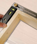 Close-up of Straight Shooter Nine In One Measuring And Marking Tool Featuring Dual Levels Sliding Bevel Depth Gauge in use on wood.