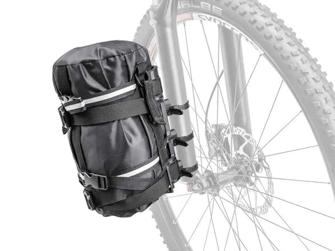VersaCage Adventure Cage With Adjustable Mounting System And VersaMount Clamps And Straps holding a dry bag on a bike fork